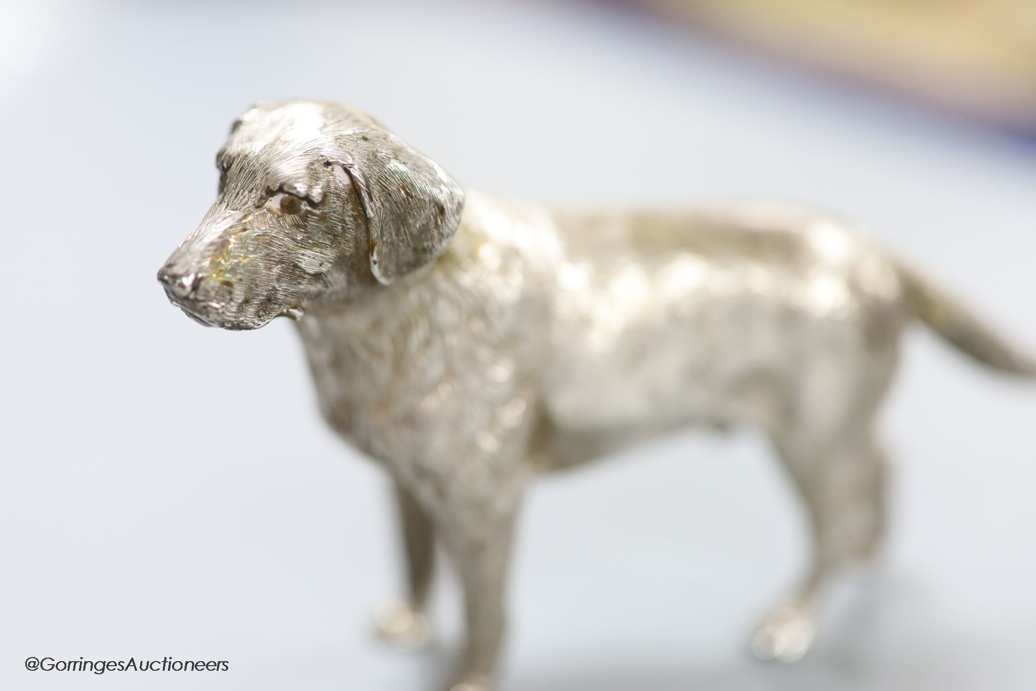 A modern free standing silver miniature model of a dog, C.F.H & Co, London, 1994, height 76mm, 243 grams.